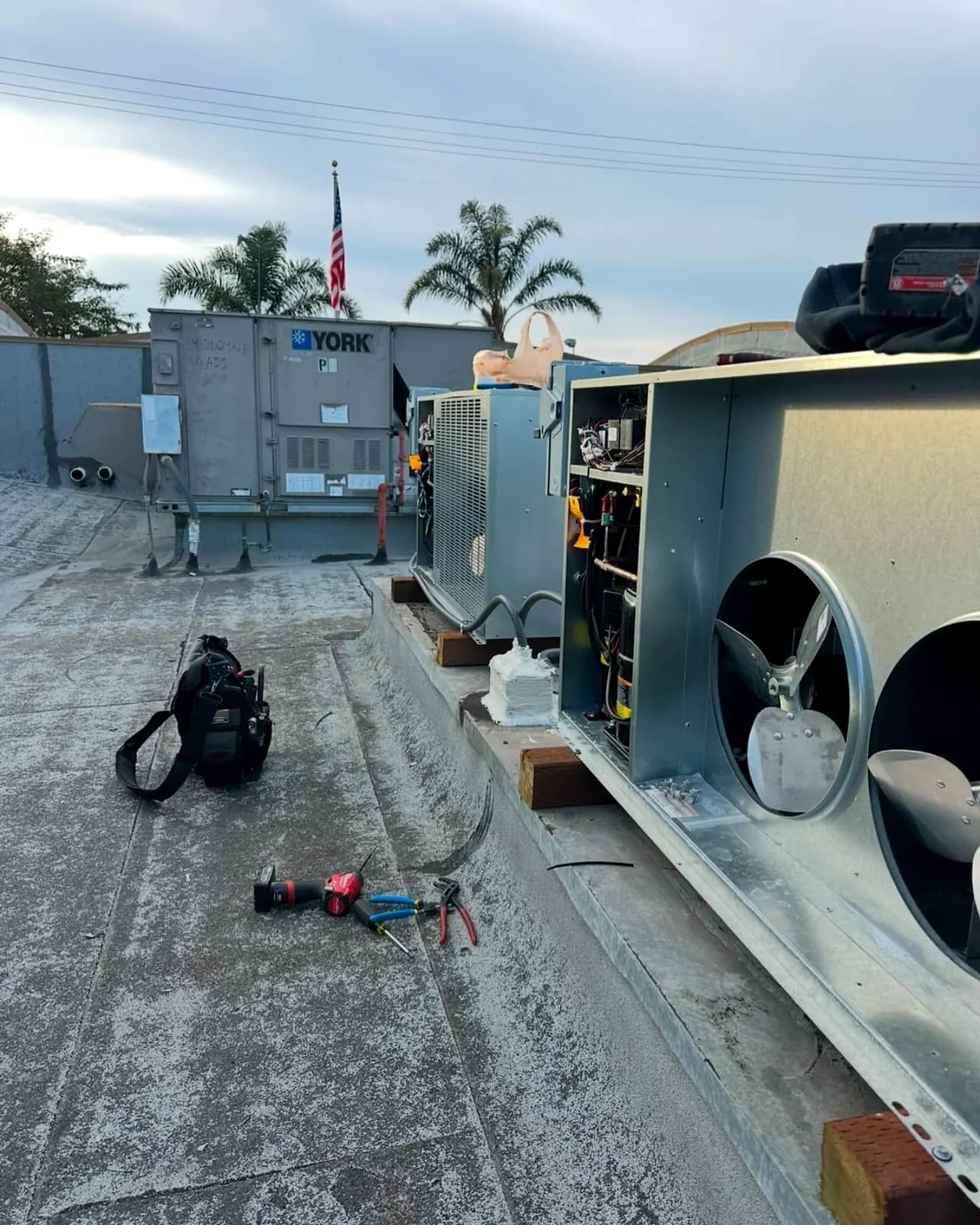Commercial rooftop HVAC unit opened for service