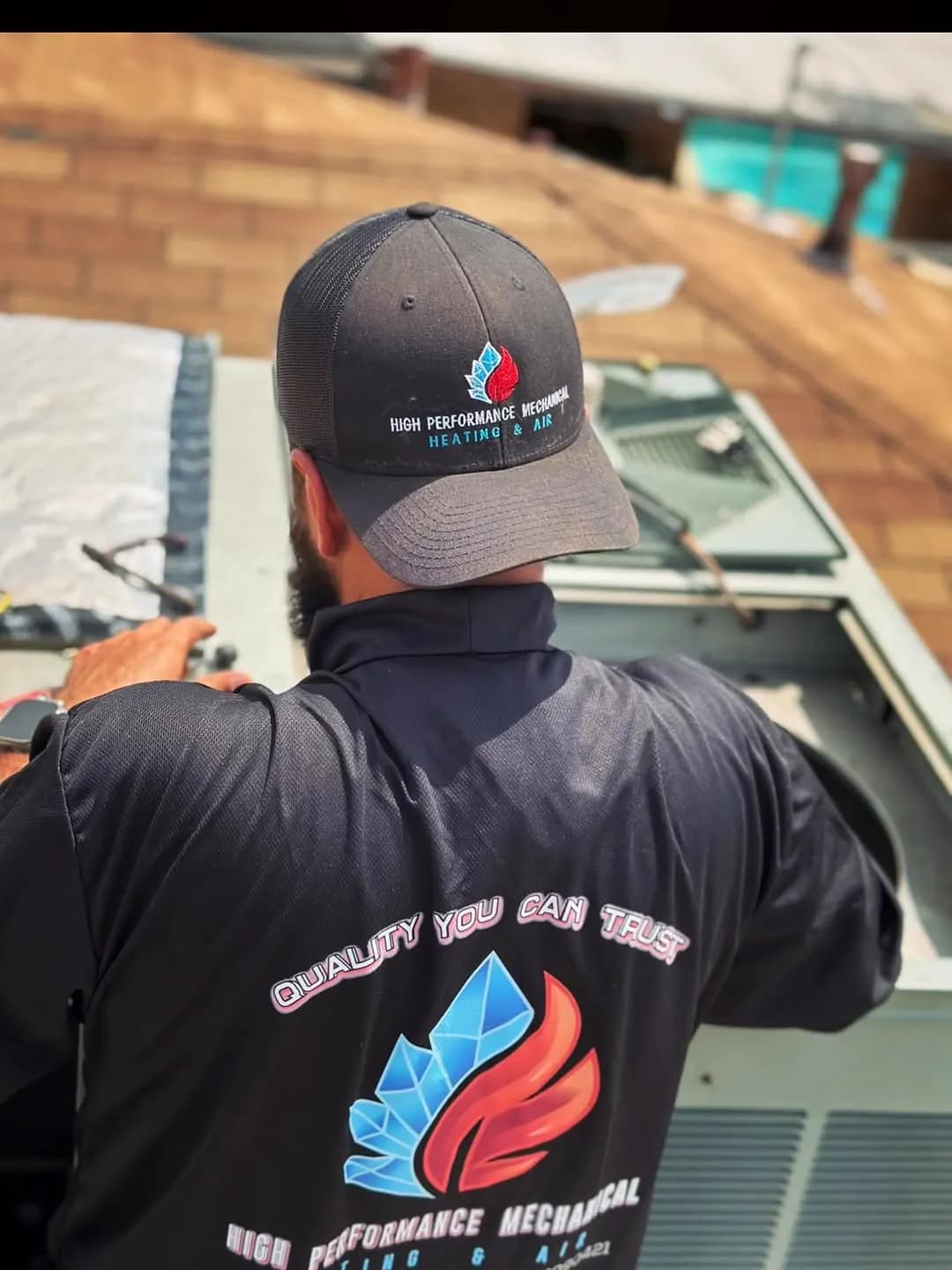 Technician performing maintenance on an HVAC unit