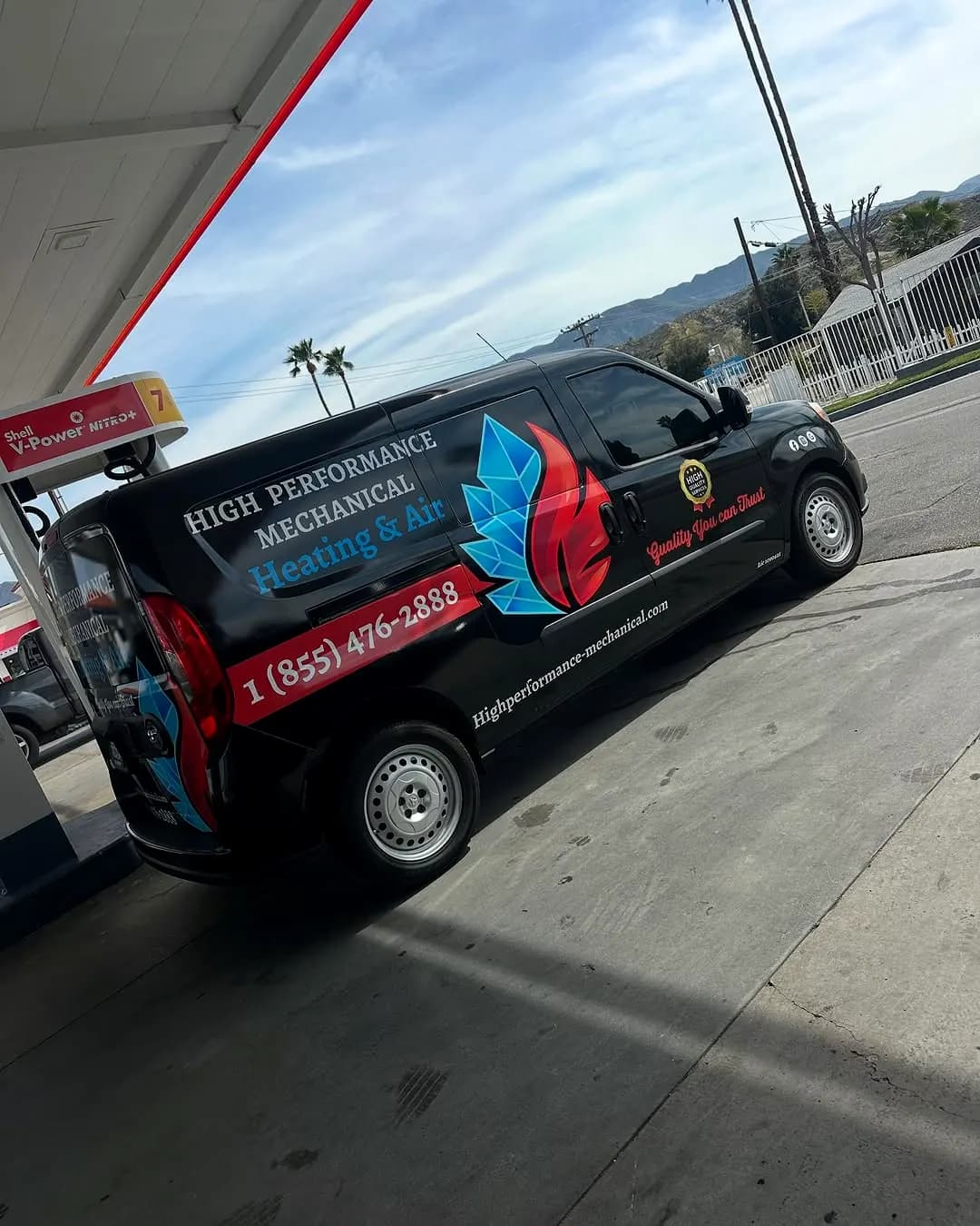 High Performance Mechanical van with the company logo