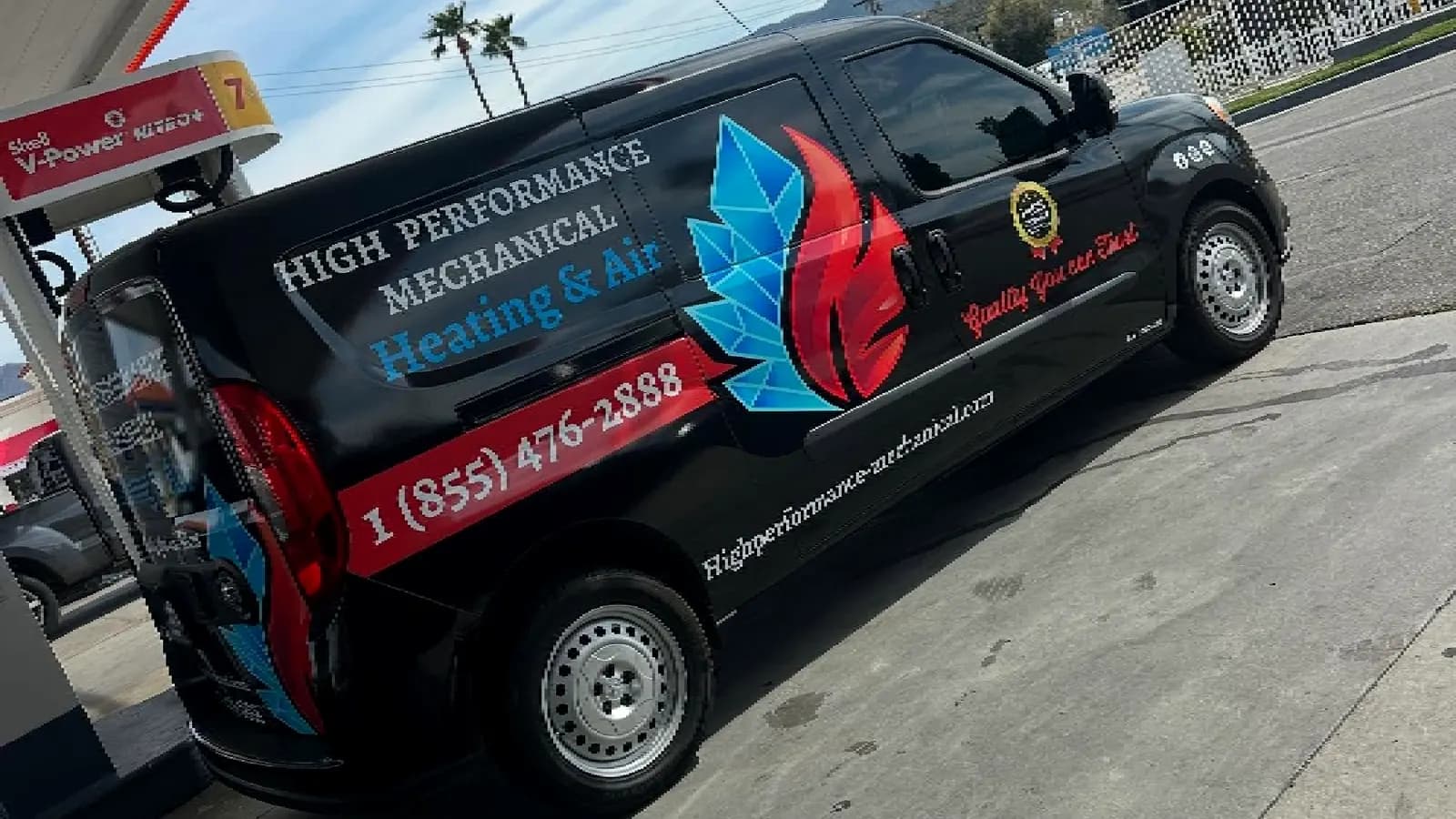 High Performance Mechanical service van parked at a fuel station